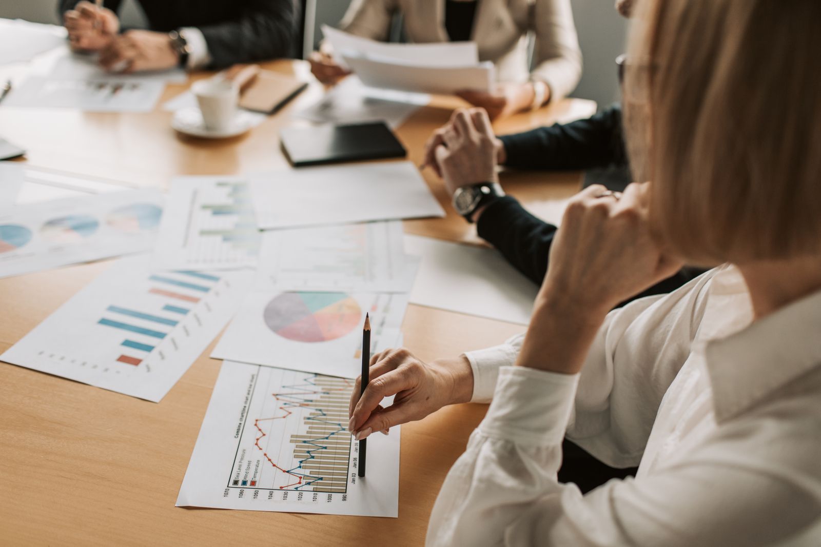Business team reviewing financial charts and graphs in a meeting